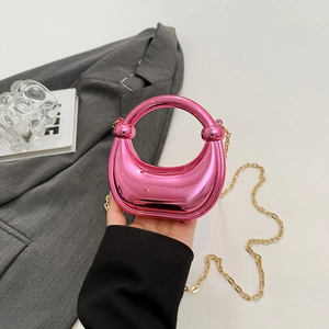 Mini metallic pink acrylic moon evening bag with gold chain strap for stylish parties