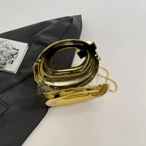 Golden acrylic evening clutch with mirror finish and hollow handle for women's gala