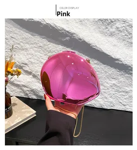 Chic pink acrylic shell-shaped clutch bag with shiny mirror finish and gold chain