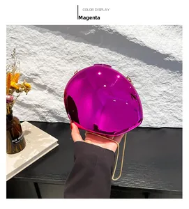 Detailed view of the rose red metallic mirror evening bag with gold chain strap