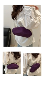 Deep purple irregular cloud-shaped clutch bag with gold chain strap in a detail collage