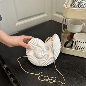 Unique conch shell evening bag with golden chain strap for summer 2025 fashion style