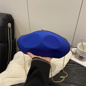Royal blue irregular acrylic clutch bag with gold chain strap for party evening wear
