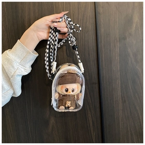 Close-up of a clear PVC doll display bag with a stylish houndstooth pattern woven strap