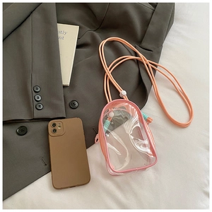 Mini transparent PVC pink jelly bag with orange strap shown next to a smartphone
