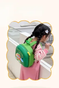 Detail view of lightweight green kids backpack with 3D excavator relief on a little girl