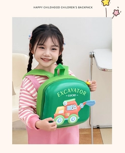 Detailed close-up of a green 3D cartoon excavator on a durable EVA hardshell toddler backpack