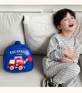 Detailed view of durable EVA eggshell backpack for kids with cartoon excavator print