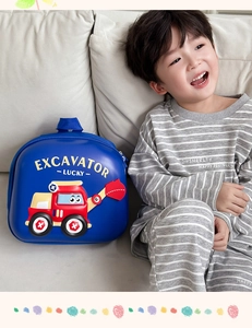 Detail of blue EVA hardshell kids backpack featuring 3D red cartoon excavator design