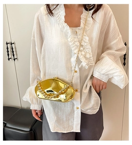 Golden meteorite acrylic clutch bag with pearl handle and metal chain for evening parties