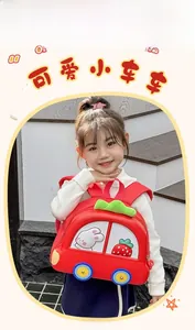 Detail of red cartoon car backpack for kids with transparent window and rabbit pattern