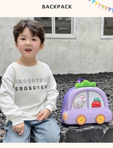 Detail of purple car-shaped EVA backpack with cute bunny and strawberry cartoon patterns