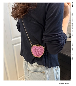 Pink sequin apple-shaped mini crossbody bag with a slim gold chain and hardshell frame