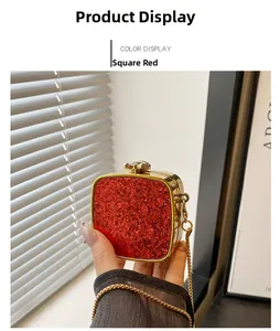Detailed view of square red glitter evening clutch bag with gold chain and metal frame