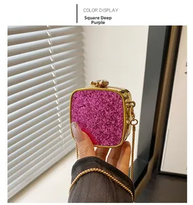 Detail of square deep purple sequin evening bag with gold chain and jewel clasp