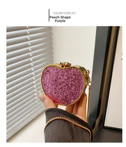 Macro view of purple glitter heart evening bag with gold metal frame and delicate chain