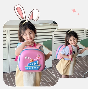 Detailed view of pink EVA hardshell kids backpack featuring 3D cartoon ship design