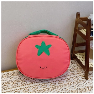 Detail view of pink nylon makeup bag with green star embroidery and happy face design