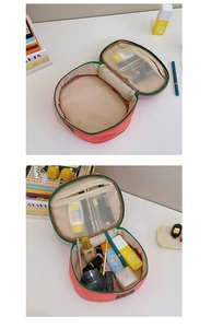 Pink waterproof nylon cosmetic bag with spacious main compartment and inner mesh zip pocket
