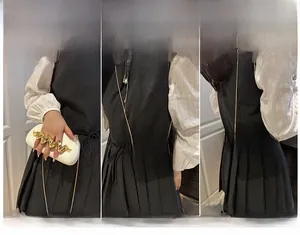 Detailed views of a white leather box bag showing handheld, shoulder, and crossbody styles