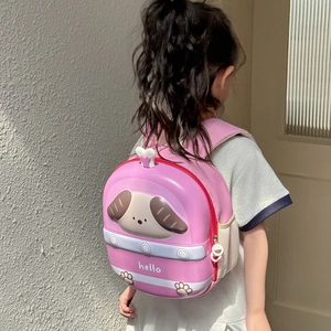 Detailed back view of a pink hard shell cartoon dog EVA backpack worn by a small girl