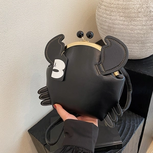 Fashionable crab shaped black crossbody bag with gold metal clasp and premium leather