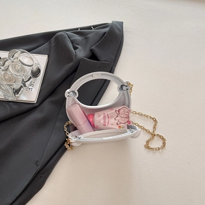 Mini borsa da sera in acrilico color caramella con catena dorata e manico rotondo