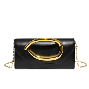 Minimalist black leather clutch featuring an artistic gold buckle and elegant chain strap