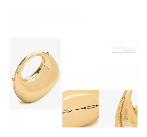 Detail of the golden acrylic crescent bag showing the metal hinges and chain links
