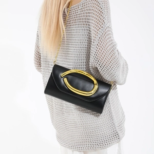 Classic black leather clutch bag with large gold metal ring and chain shoulder strap