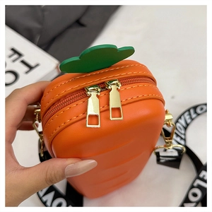 Close-up of carrot-shaped silicone bag with double metal zippers and litchi texture