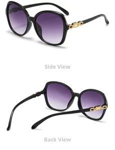 Detail view of large round sunglasses featuring purple gradient lenses and gold chain temples