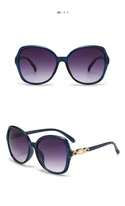 Detailed front and side views of blue gradient sunglasses with gold chain temples