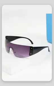 Detail of futuristic oversized purple gradient sunglasses with star metal studs