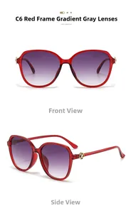 Detail of red oversized sunglasses with golden rose hinge and gradient grey lenses