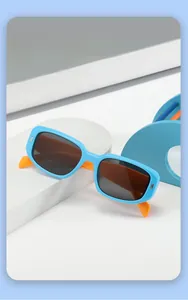 Close-up of sky blue and orange contrast frame kids sunglasses for UV protection