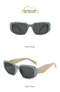 Detail view of colorful kids sunglasses with green frames and gray lenses for sun protection