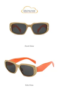 Detail of vintage rectangular kids sunglasses with coffee frames and orange temples