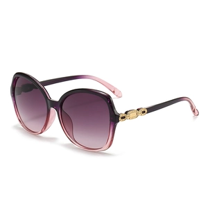 Stylish oversized purple gradient sunglasses for women with gold chain detail on the temples
