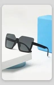 Detail shot of futuristic black square sunglasses on geometric blue display blocks
