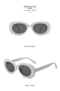 Close-up of white oval frame sunglasses with grey lenses in front and 45-degree view