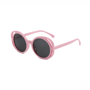 Pink hollow frame round sunglasses for girls with dark lenses for UV protection