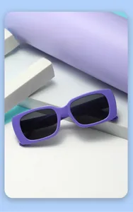 Close-up of purple rectangular children's sunglasses with UV protection on creative props
