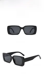 Detailed views of baby sunglasses with thick black frames and protective grey lenses