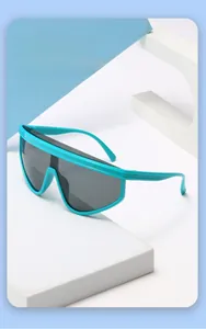 Detail of mint green frame kids sunglasses with dark grey one-piece protective lens