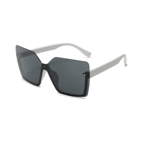 Futuristic oversized rimless sunglasses with dark gray lenses and white temples