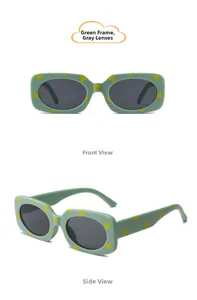Detail of green square frame kids sunglasses with yellow heart prints and grey lenses