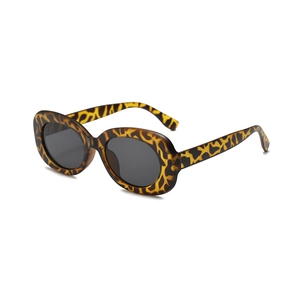 Chic leopard print sunglasses with oval grey lenses shown from a 45-degree angle view