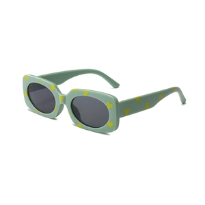 Mint green kids heart print sunglasses with dark grey lenses in rectangular frame