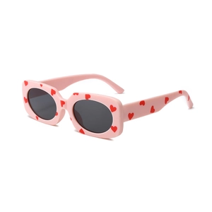 Kids heart print sunglasses with pink frames and dark lenses in retro rectangular style